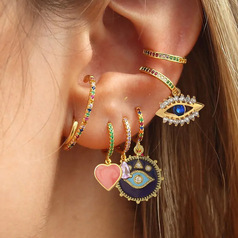 Pendientes de Aro Diseño Corazón y Ojo Azul - Color Dorado